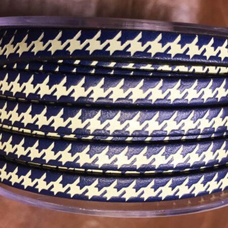 HOUNDSTOOTH or Pied-de-Poule fashion style, the traditional made with a dark and a light color. The Houndstooth pattern are very employed for prominently fashion companies.