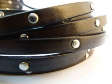 Strip of black leather with rivets. Ref. TCP 5x2 with studs every 2.5 cm.
