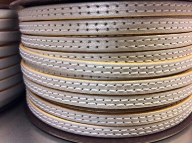 6x2 mm leather strip. Silver color with gold edges and two sewn