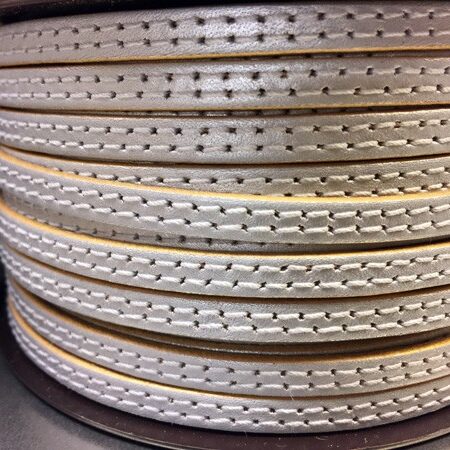 6x2 mm leather strip. Silver color with gold edges and two sewn