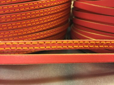6x2 mm leather strip. Orange color with gold edges and two sewn