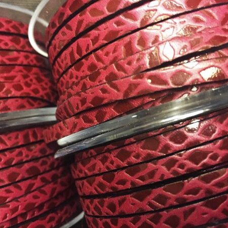 5x2 mm leather strap. red color with giraffe engraving with red transfer.