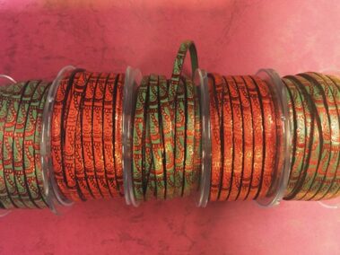 Leather strip 5x2 mm. green and red with engraving Waves with red metal transfer