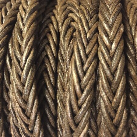 Braid of 7 strands of round leather cord CCC 2 mink color. Braided by hand. It measures 12x3.5 mm.