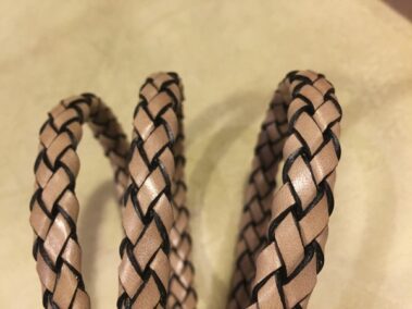 Hand braided leather 10x6 mm Ref. TRO 10x6 beige color and black edges