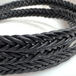Spike braided leather cord.
