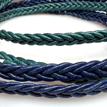 Spike braided leather cord.