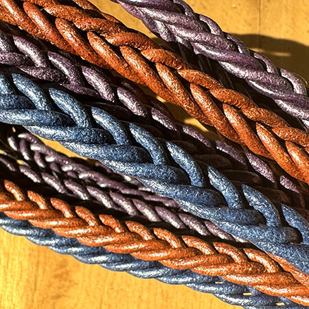 Spike braided leather cord.