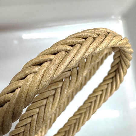 Spike braided leather cord.